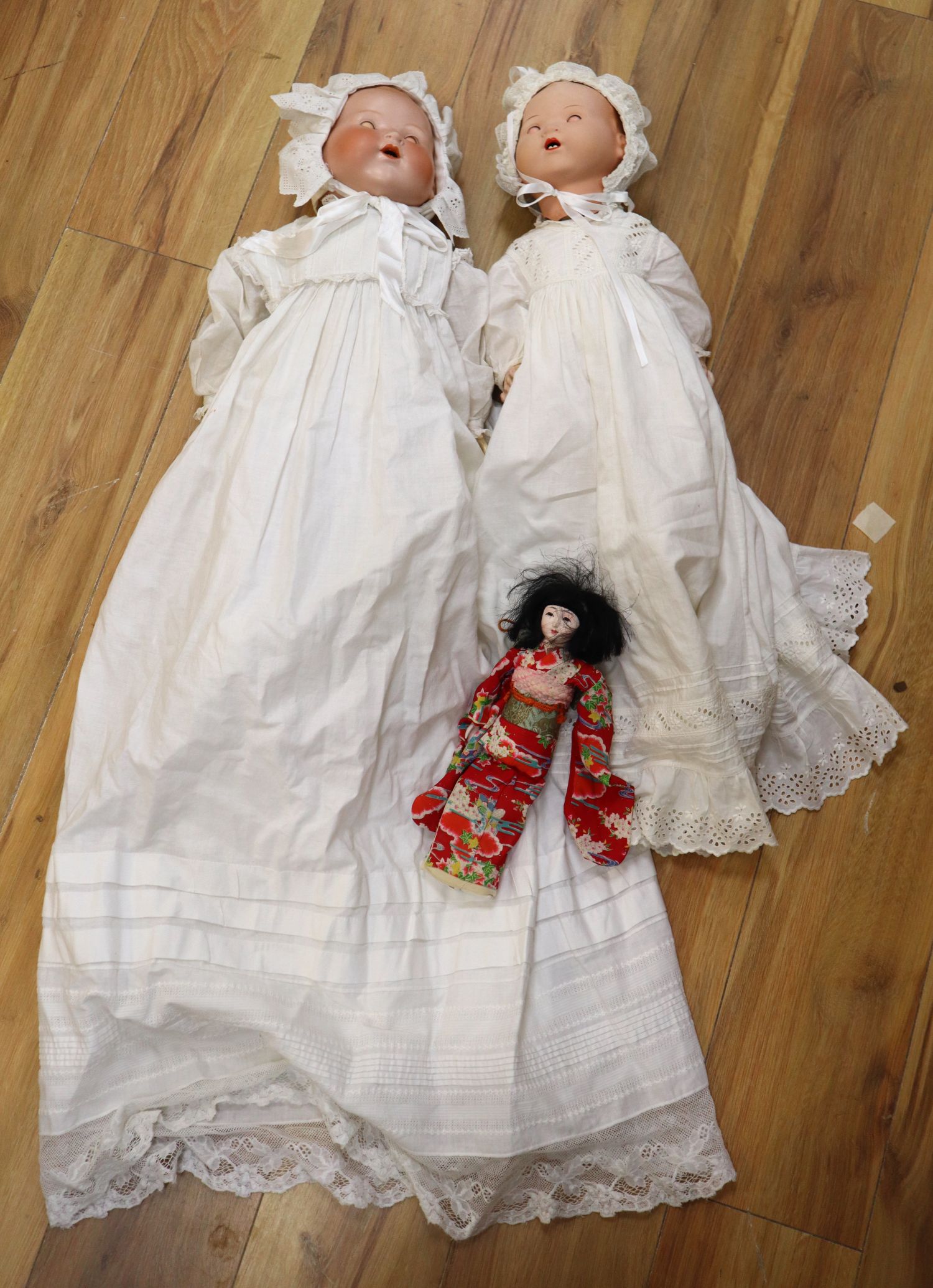 Two Armand Marseille bisque headed dolls and a similar Japanese geisha doll